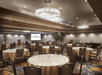 Banquet/Conference room complete with round tables and chairs.
