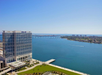 Beautiful-landscaped hotel exterior with bayfront view.