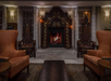 Hotel lounge with a fireplace and leather seating