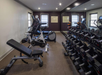 Fitness facilities including free weights, stationary bikes, and more