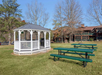 Enjoy alfresco dining in the outdoor eating area, complete with a BBQ griller for a flavorful experience.