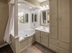 Jetted tub with a shower in a One-Bedroom unit.