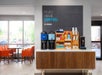 Coffee and tea station with seating area.