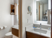 Guest bathroom with lighted mirrors.