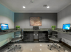 A modern office space with two computer workstations, swivel chairs, and a decorative wall art piece.