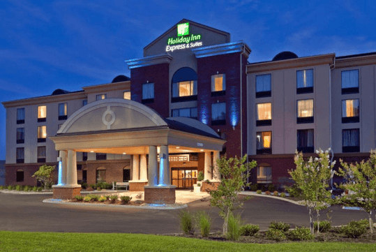 Hotel exterior at night.