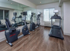 Fitness room with plenty of gym equipment.