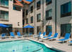 Outdoor pool and sun loungers.