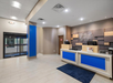 Experience friendly service at the front desk table, ready to help with your stay.