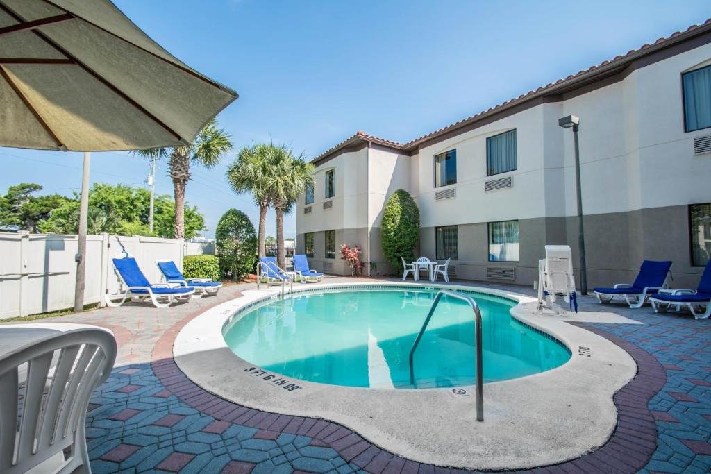 Outdoor pool with sun loungers