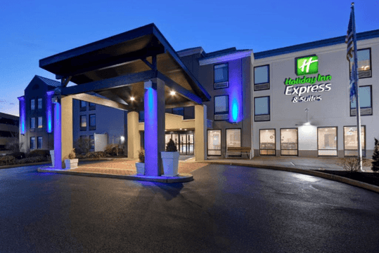 Hotel exterior view and main entrance at night.