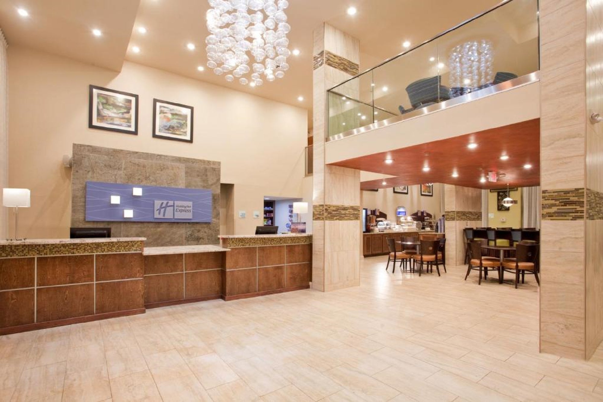 Hotel lobby, breakfast dining area, and registration desk.