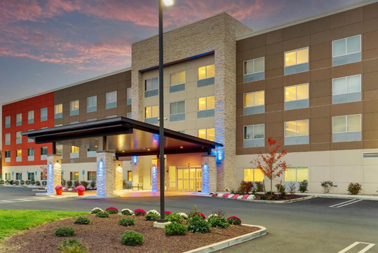 Hotel exterior at dusk.