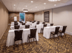 Meeting facility complete with tables and chairs.