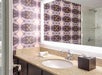 Fresh towels and bathroom amenities inside a private bathroom