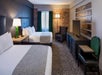 Two double beds inside a non-smoking guest room