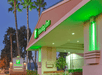 Hotel exterior at night.