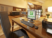 24-hour business center with a desktop computer and a printer.