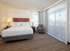 One king bed inside a guest room.