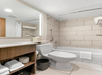 Guest bathroom with a tub and shower combination.