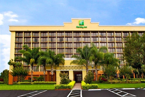 Front entrance and parking lot at Holiday Inn Orlando SW - Celebration Area in Kissimmee, Florida.