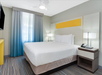 King bed inside a guest room.