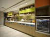 Breakfast area with a variety of breakfast items, microwave, and more.
