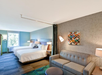 2 Queen beds, seating area, sofa bed at Home2 Suites By Hilton Tampa USF Near Busch Gardens, FL.