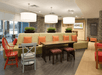 Well-lit lobby lounge with seating area.