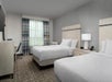 Two double beds with Serta Suite Dreams(R) bedding.