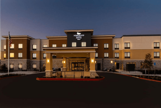 Hotel exterior at dusk.