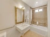 Guest bathroom with a tub and shower combination.