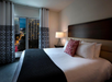 One king bed inside a guest room.