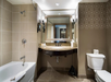 Shower and tub combination inside a private bathroom.