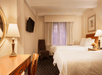 One King bed and a flat-screen TV inside a guest room.