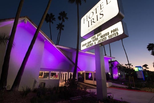 Hotel exterior at dusk.