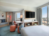 Guest room with 1 King bed, flat-screen TV, and a seating area.