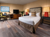 King bed, TV, and work desk for comfort and productivity.