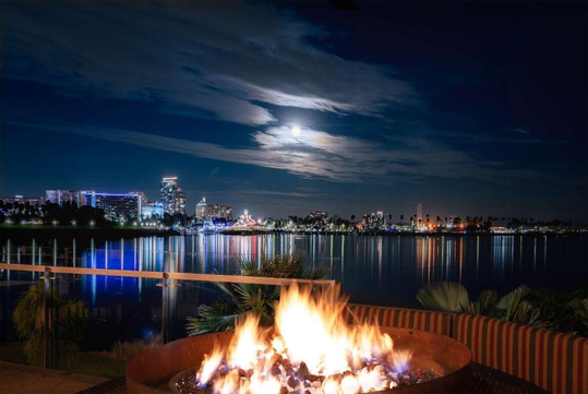 Cozy fire pit with a beautiful water view.