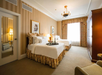 Two double beds inside a beautiful guest room.