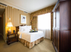 One king bed inside a beautiful guest room.