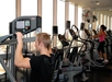 Fitness room with cardio equipment.