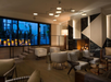 Lobby with fire place and seating area.