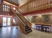 Wooden stairs leading upstairs to the second floor.