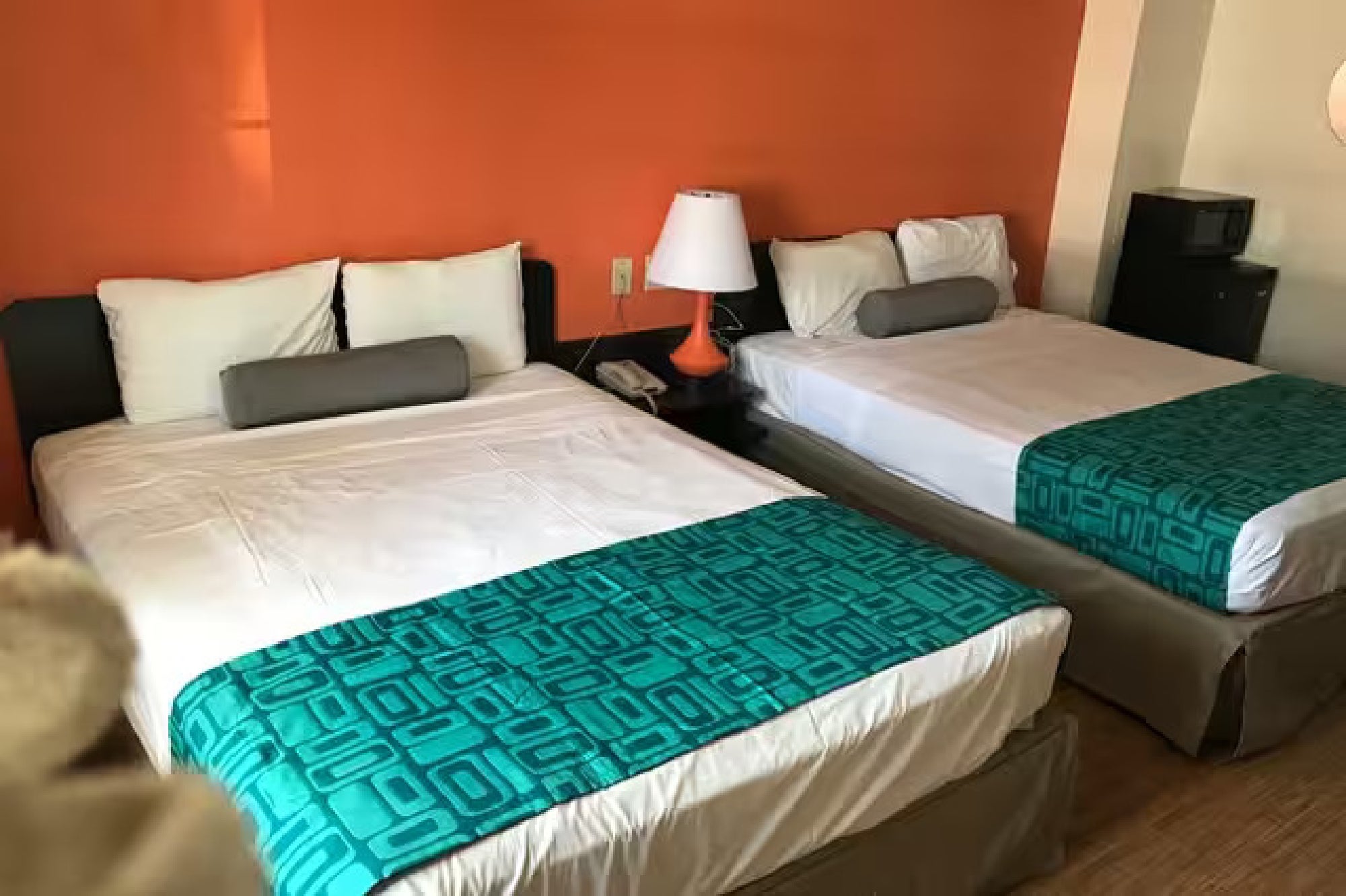 Guest room with two queen beds, a microwave, and a mini-fridge