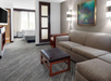 Seating area with sofa bed in a guest room at Hyatt Place Secaucus/Meadowlands.