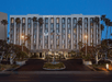 Hotel exterior at night.