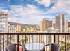 Private balcony with city view and seating area.