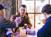 Men drinking beers inside The Point at Boston Crawling tours