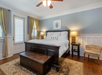 Guest room with a king bed, chest, and nightstands